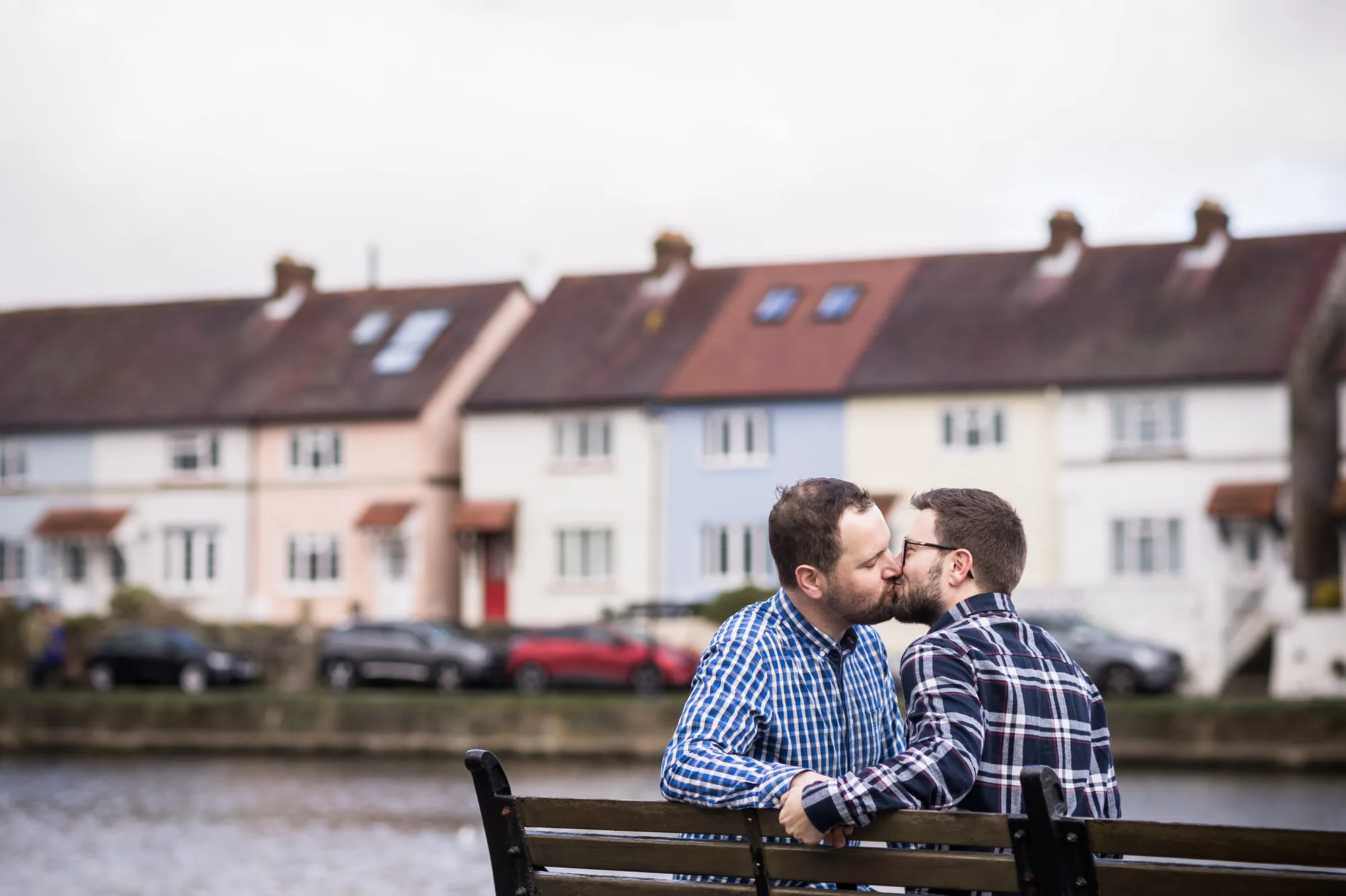 Engagement Photo Shoot - two men kiss on the waterfront in Emsworth in Hampshire