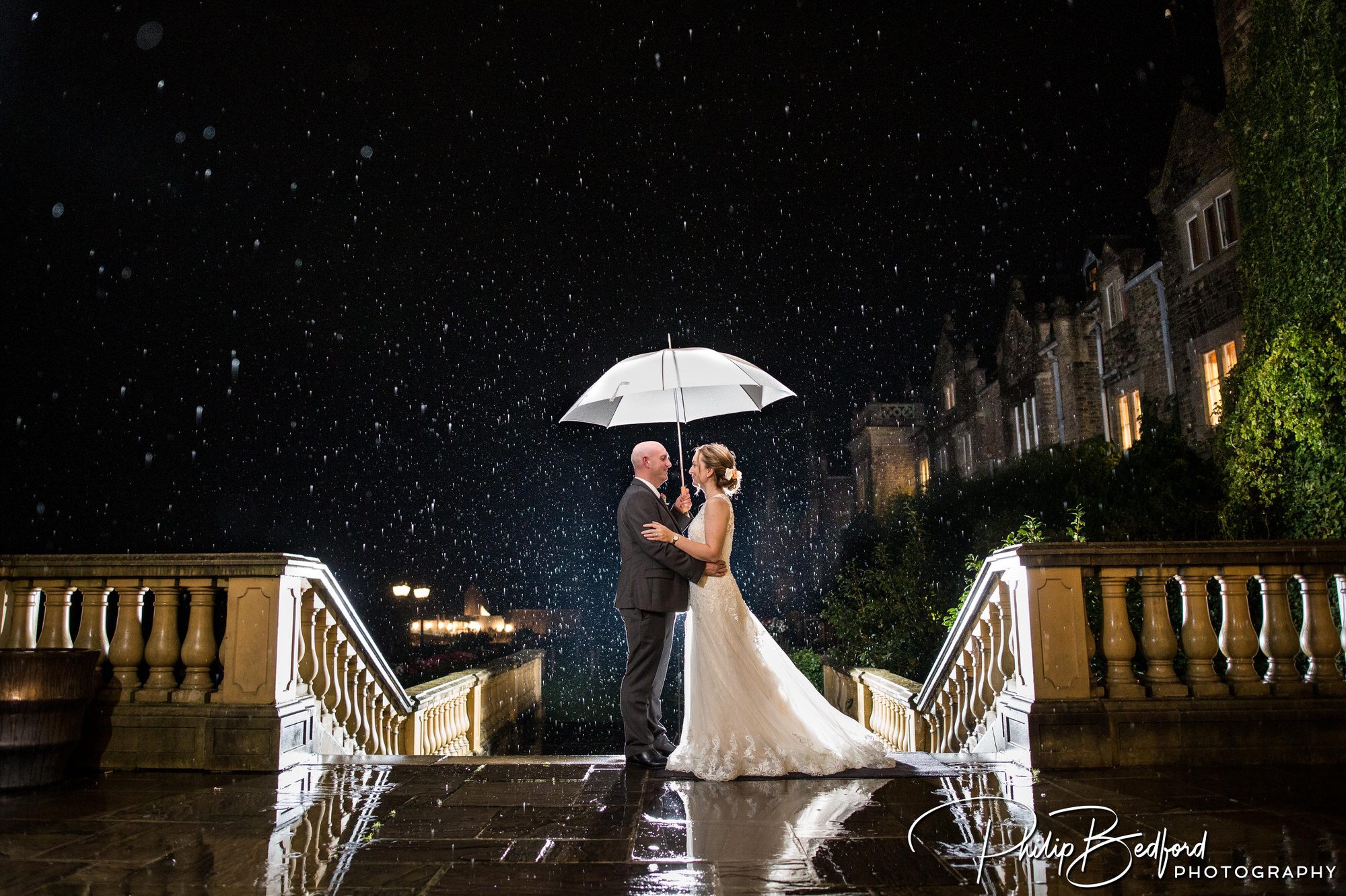Reportage Wedding photograph of Bride & Groom in the rain