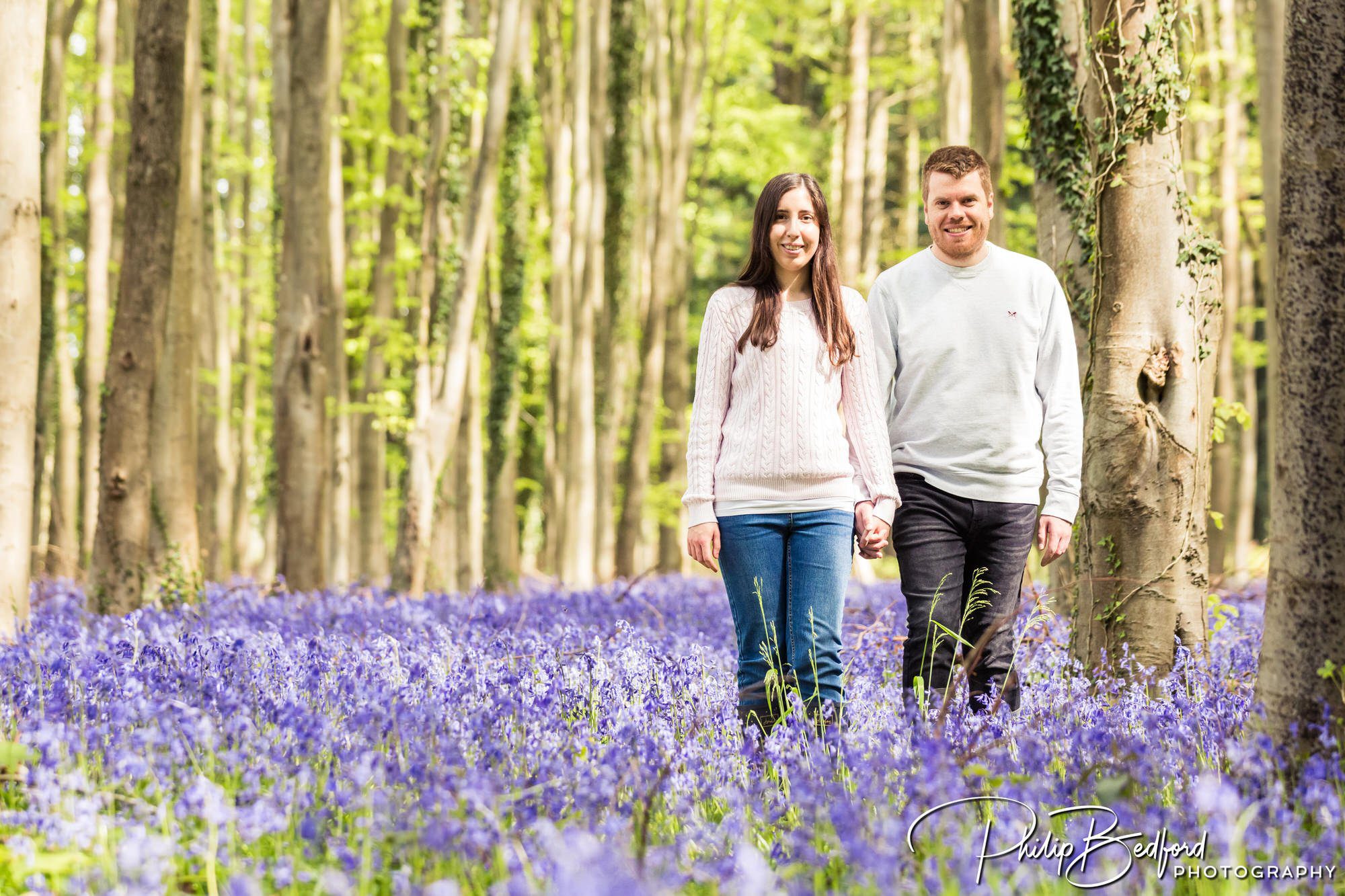 Man & Woman amongst Bluebells on a Engagement Shoot near Worthing, West Sussex