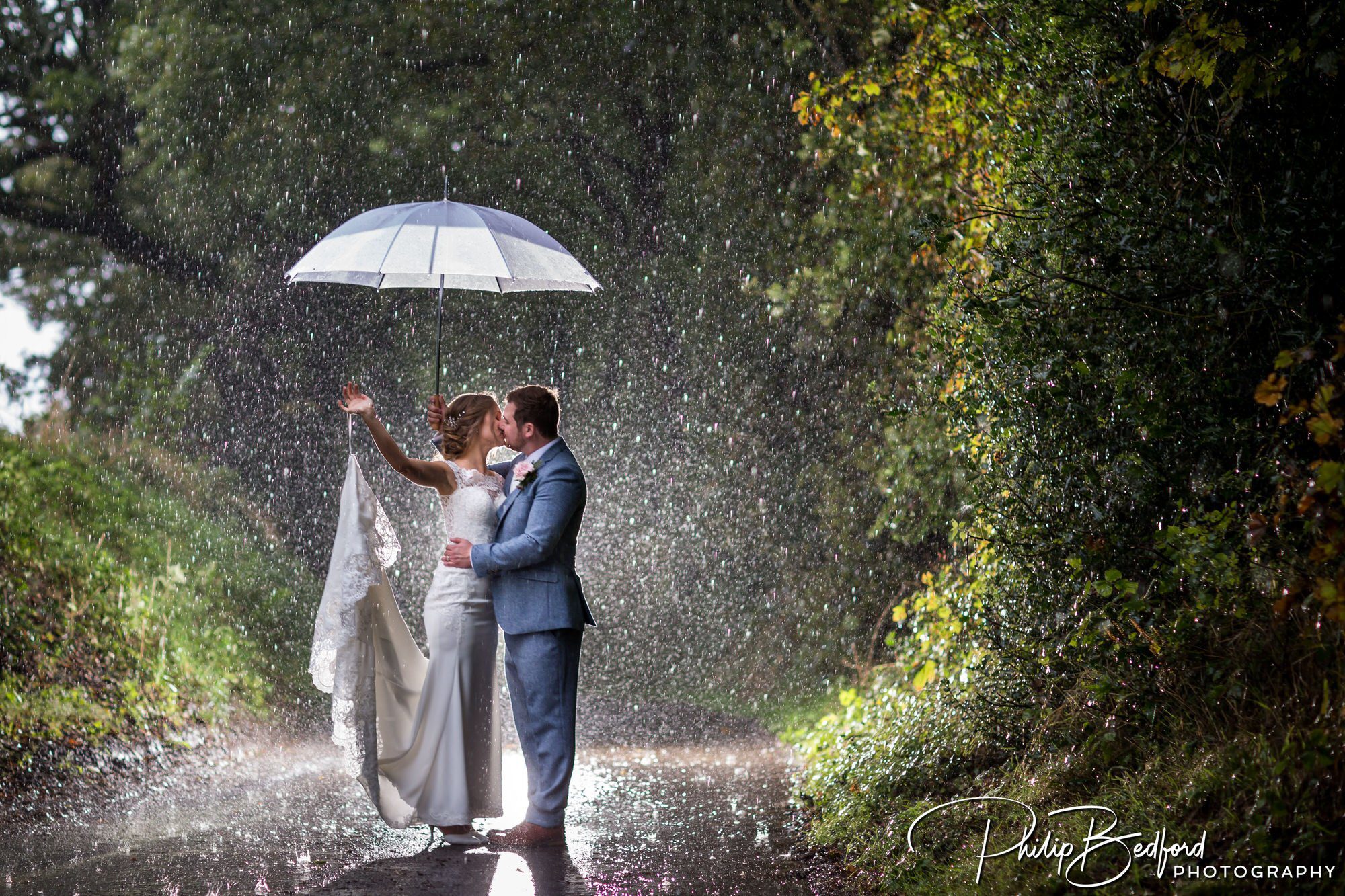 Fitzleroi Barn Autumn Wedding: Bride and Groom in the rain
