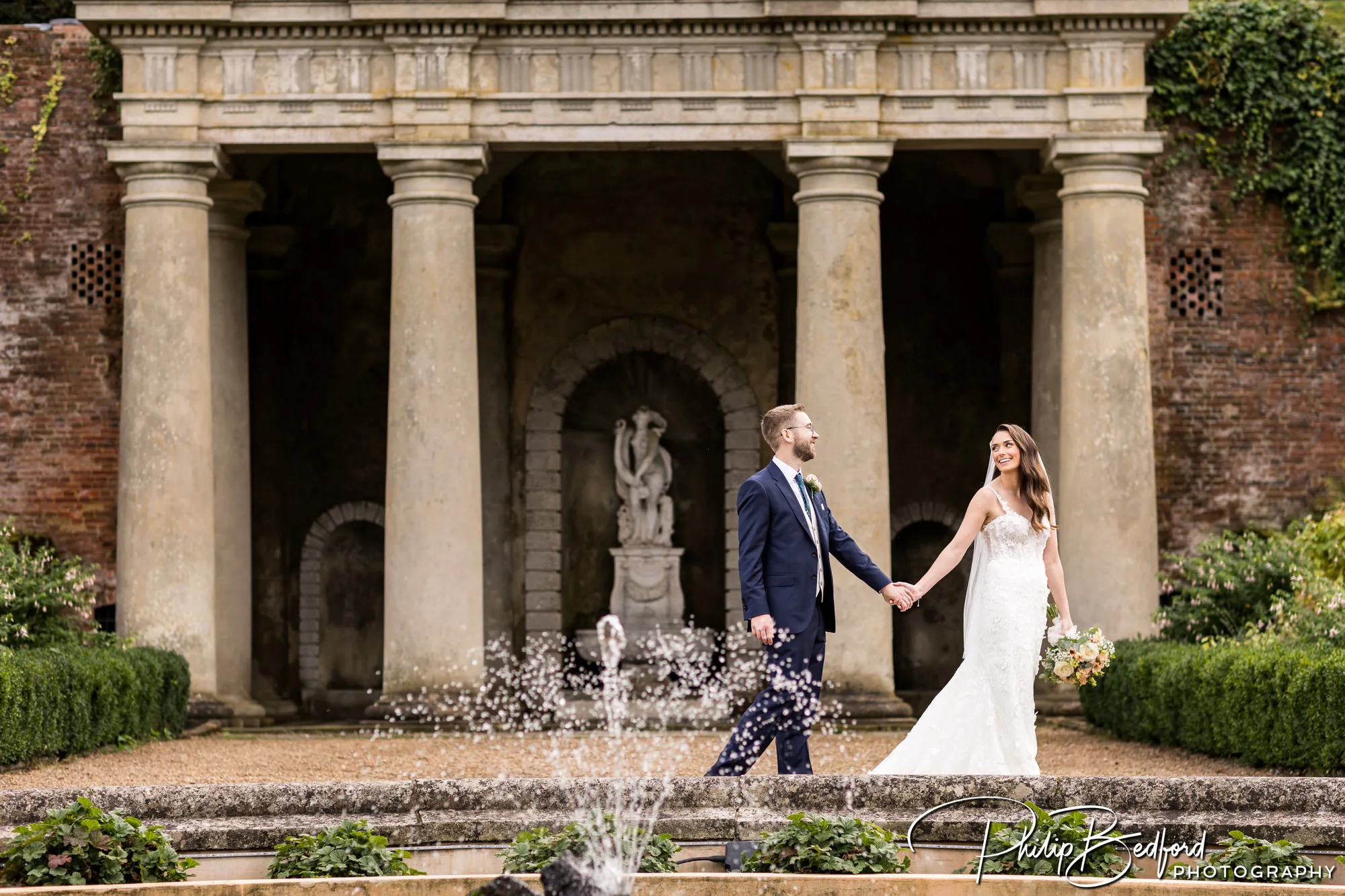 Wotton House Autumn Wedding - Bride & Groom walking in the Italian Gardens