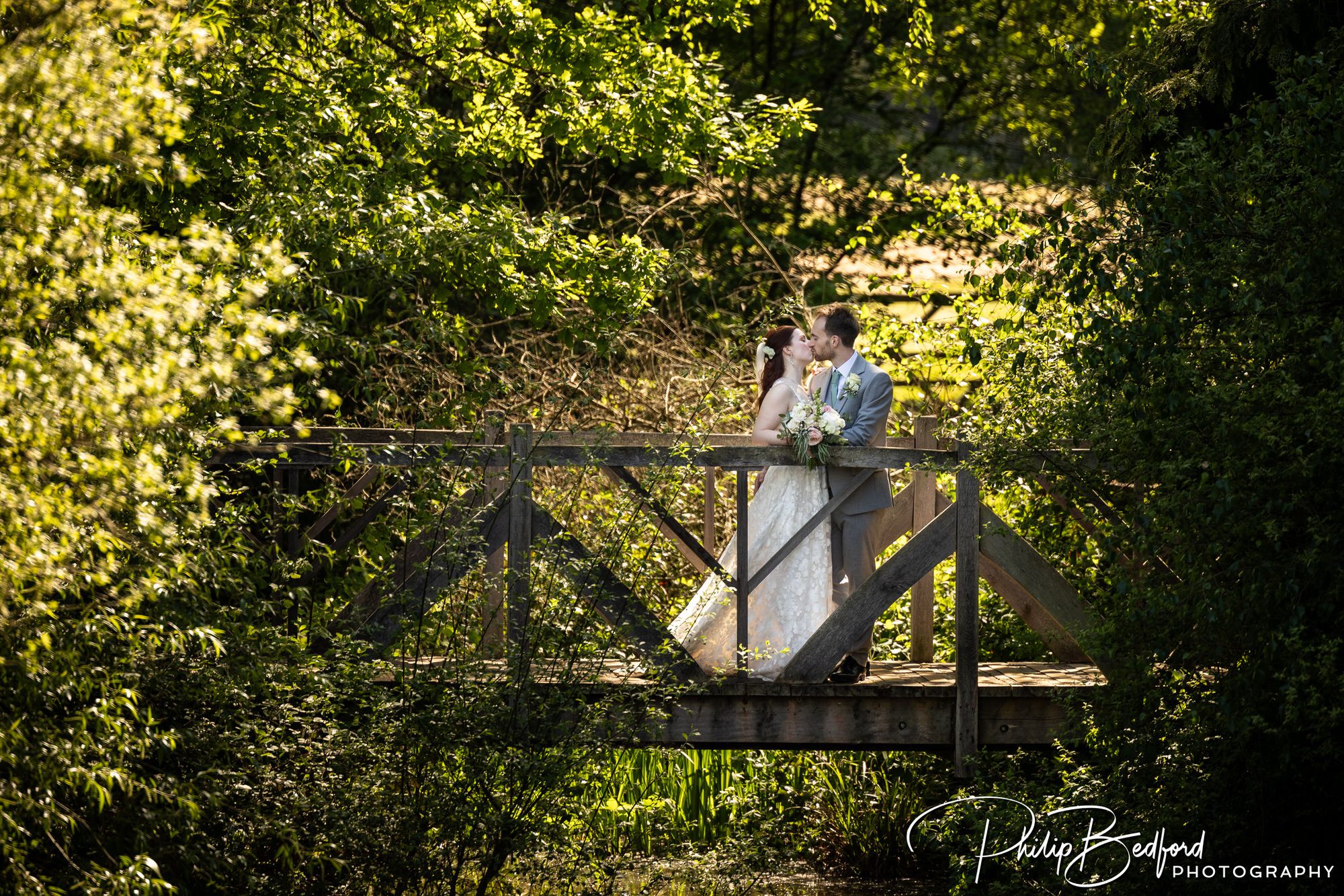 Brookfield Barn Wedding bridge across the river